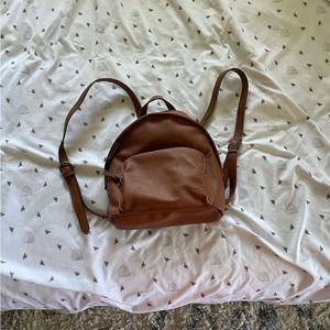 Universal thread brown faux leather backpack.